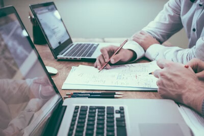 Corporate documents and pen